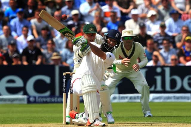 England batsman Moeen Ali drives the ball off Australia spin bowler Nathan Lyon on day two in Cardiff. Picture: PA.