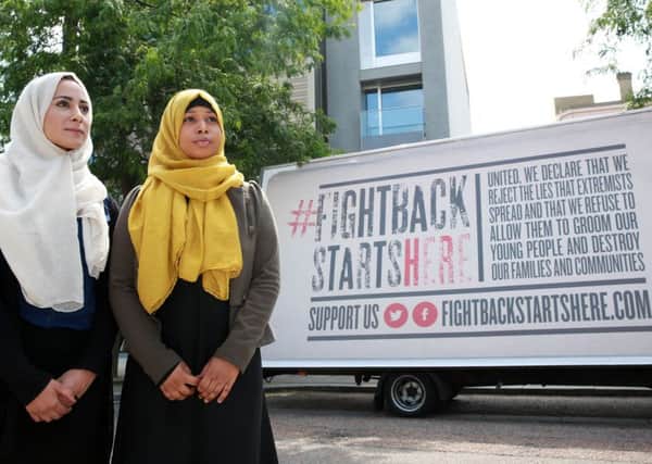 Aqsa latif (left) and Fatma Abule from Active Change Foundation support the #fightbackstartshere campaign, with an open letter signed by more than 100 charities, civil society organisations and community leaders from across the UK, which will be published today pledging their collective support to fightback against all forms of extremism, in central London. (Picture: Matt Alexander/PA Wire)