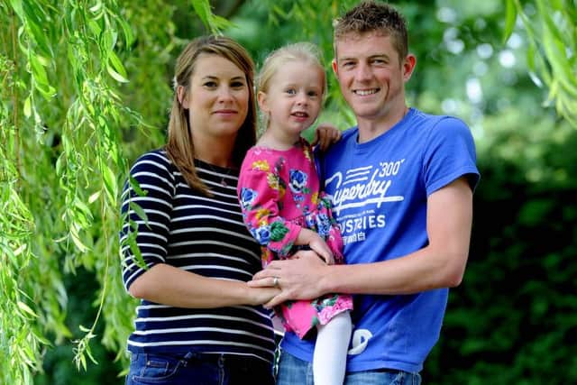 Parents Liam and Ami Duggleby with their daughter Lilly, three, months after their second daughter Minnie passed away at just 23-days-old. Picture by James Hardisty.