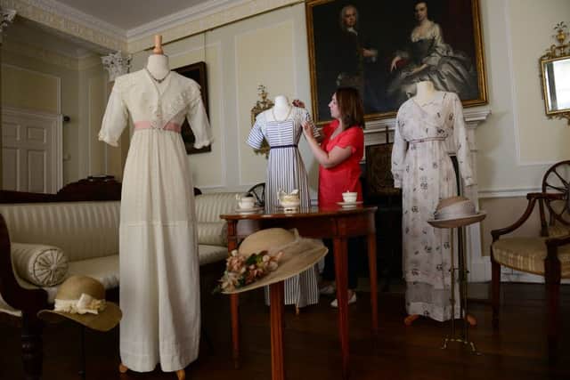 Curator Jemma Conway with the exhibits at the new exhibition of costumes from the drama Downton Abbey
