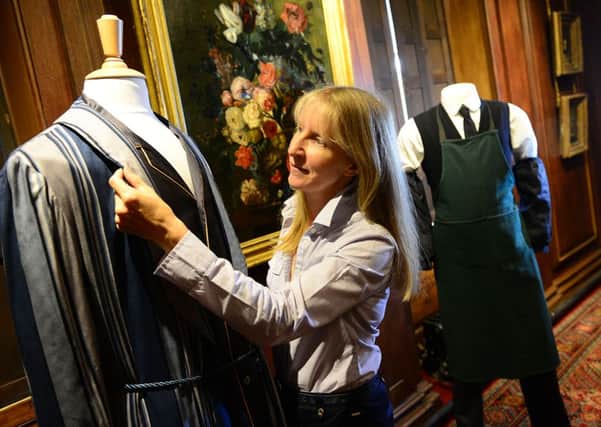 Christine McSweeney from Cosprop with the exhibits at the new exhibition of costumes from the ITV drama Downton Abbey