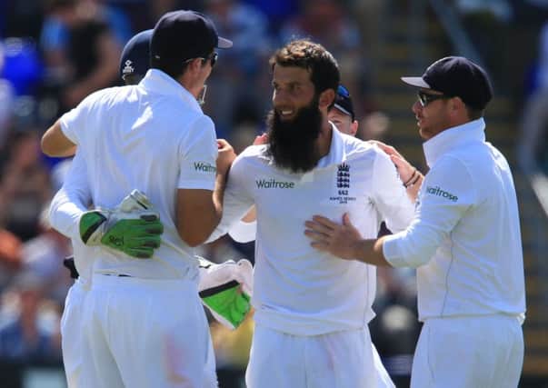 England bowler Moeen Ali celebrates taking wicket of Australia batsman Steve Smith.