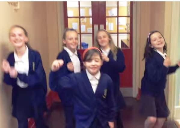 Pupils and teachers from Ainthorpe Primary School in Hull miming to Uptown Funk on YouTube