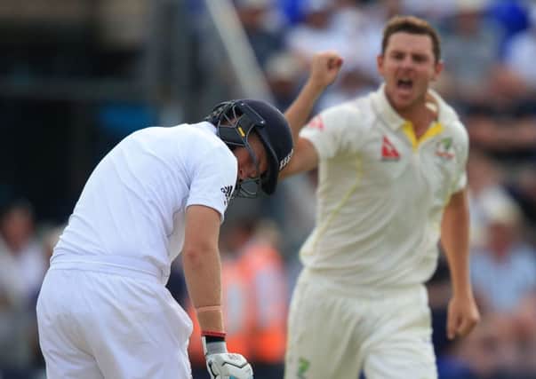 England batsman Joe Root looks back at his stumps as he bowled for 60 by Australia's Josh Hazlewood.