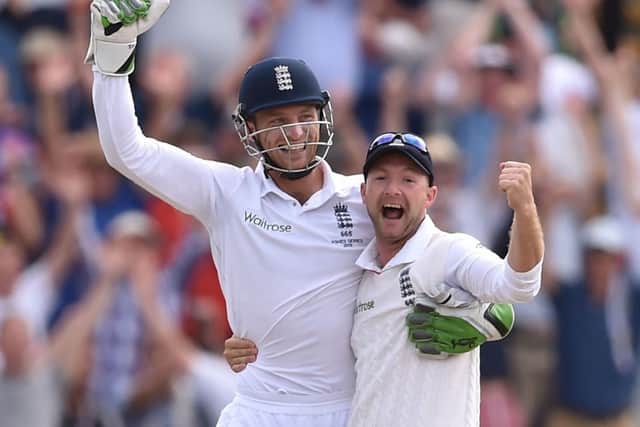 England's Jos Buttler (left) and Adam Lyth (right) celebrate victory in the First Investec Ashes Test at the SWALEC Stadium, Cardiff. Picture: Joe Giddens/PA.