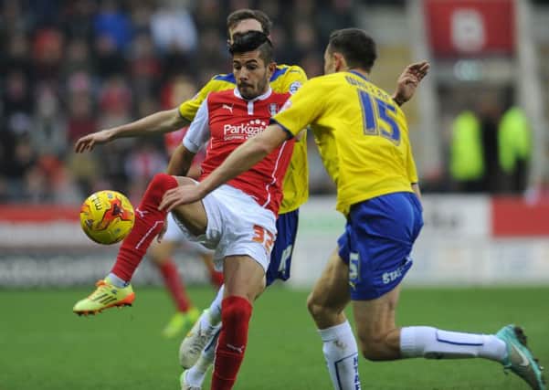 Emmanuel Ledesma, in action for Rotherham United against Huddersfield Town during his loan spell at the New York Stadium last season, is delighted to be reunited with manager Steve Evans (Picture: Bruce Rollinson).