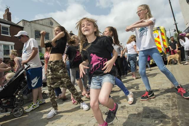Urban dance groups perform in amongst the crowd at the Pontefract Liquorice Festival