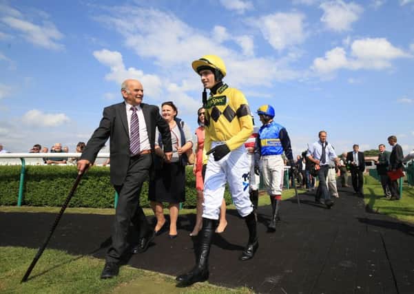Jockey Brian Toomey enters the parade ring on his comeback race at Southwell Racecourse. Picture: Nigel French/PA.