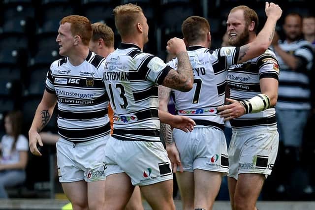 Hull FC players celebrate their victory.