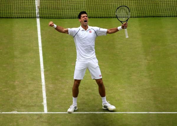 Novak Djokovic celebrates winning his third men's singles title at Wimbledon
