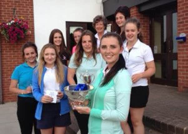 Cleckheaton's Megan Clarke, front, with other prize winners at Yorkshire's junior championships at Middlesbrough GC.