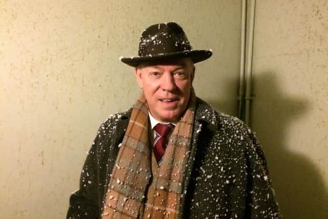 Bill Ilkley as Major Metcalfe getting a dusting of snow backstage before stepping out from the wings. .