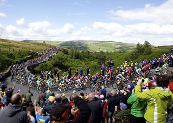 Tour cyclists take on Grinton Moor during stage one of the 2014 Grand Depart. Picture by Shaun Flannery/SWpix.com.