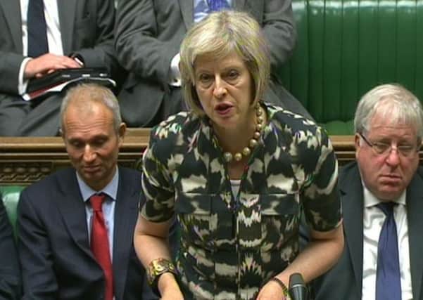 Theresa May announces a new "secure zone" at Calais in the Commons