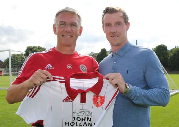 Sheffield United's new signing Martyn Woolford with boss Nigel Adkins.