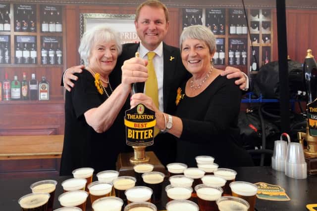 Sir Gary Verity pictured with Calender Girls Linda Logan (left) and Angela Baker