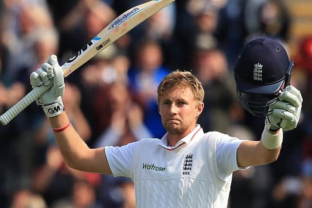 Joe Root celebrates reaching his century against Australia during the first Test in Cardiff (Picture: Nick Potts/PA).