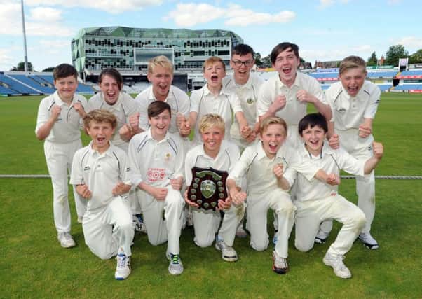Benton Park celebrate on the hallowed turf at Headingley after winning the 2015 edition of The Yorkshire Post Schools Cricket Challenge (Picture: Steve Riding).