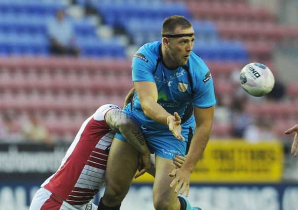 Liam Watts of Hull passes under pressure