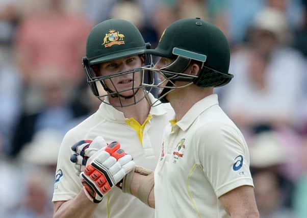 Australia's Steve Smith and Chris Rogers congratulate one another at Lord's.