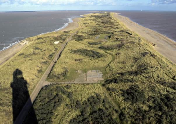 Looking north along Spurn Point from the top of the 150ft high lighthouse - the shadow of which can be see