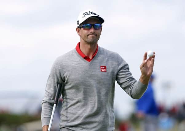 Adam Scott acknowledges the crowd after completing the 17th hole, the Road Hole, at St Andrews yesterday (Picture: Danny Lowson/PA Wire).