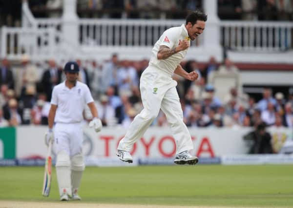 Australia bowler Mitchell Johnson celebrates taking wicket of England batsman Joe Root. Picture: Nick Potts/PA