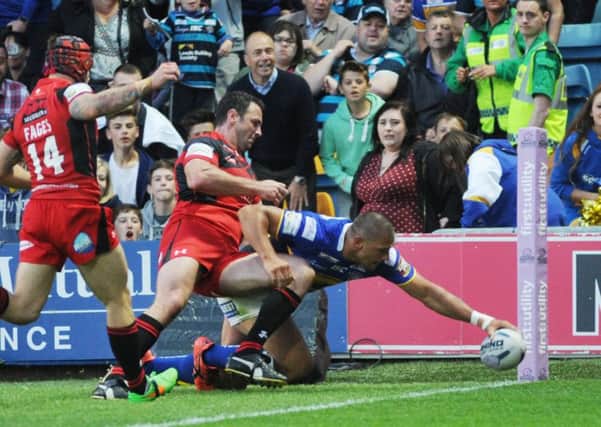 WITHIN REACH: Ryan Hall stretches to score for Leeds in their runaway win over Salford. Picture: Steve Riding
