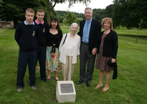 Pictured at the plaque ceremony are Charles Hughes's grandsons, Harry Taylor Hughes and Edward Taylor Hughes, their mother and his daughter Sally Taylor Hughes, Charles's wife Margaret, their son John and his wife Carolyn.