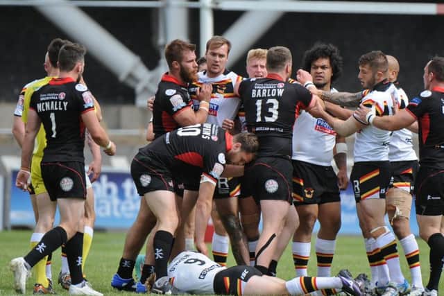 LAID LOW: Tempers flare as Bradford Bulls Adam OBrien lies prostrate on the ground after being felled by a high shot from Leigh Centurions Sam Barlow, who was surprisingly not shown a card by Super League referee James Child for the incident. Picture: Richard Land/RLphotos