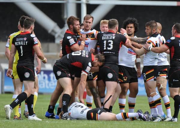 LAID LOW: Tempers flare as Bradford Bulls Adam OBrien lies prostrate on the ground after being felled by a high shot from Leigh Centurions Sam Barlow, who was surprisingly not shown a card by Super League referee James Child for the incident. Picture: Richard Land/RLphotos