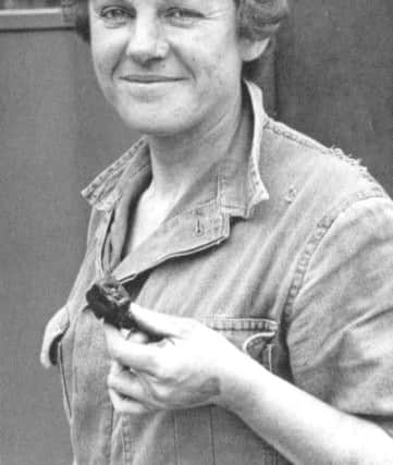 Joan Hart in her overalls and headlamp