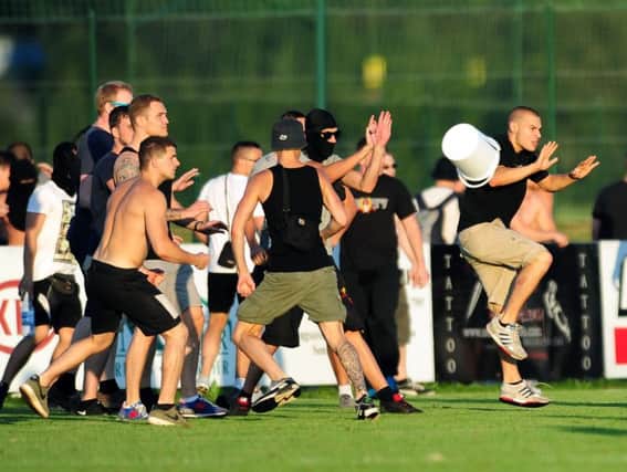 Fans clash during tonight's match. Picture : Jonathan Gawthorpe