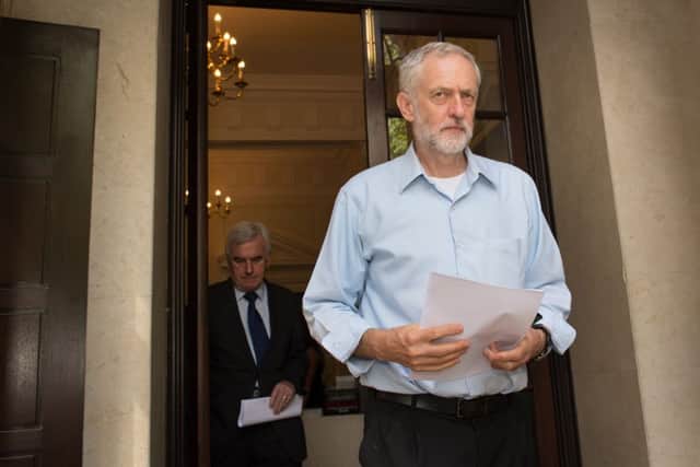 Labour leader contender, Jeremy Corbyn leaves the Royal College of Nursing in central London after delivering a speech where he set out an economic plan involving higher taxes on the rich and businesses, "sharply rising" investment in the economy and a clampdown on tax avoidance and evasion.