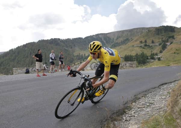 CATCH ME IF YOU CAN: Britain's Chris Froome, wearing the overall leader's yellow jersey, speeds down Allos pass during the 17th stage of the Tour de France. Picture:  AP/Laurent Cipriani.
