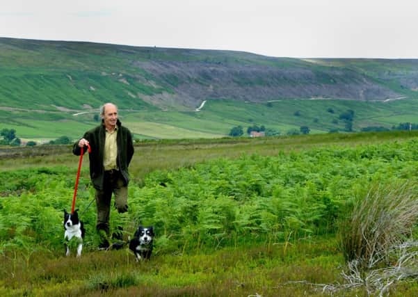 Anthony Simpson with Bess his younger sheepdog, left, and Tyke on Bransdale Moor.  Picture: Gary Longbottom
