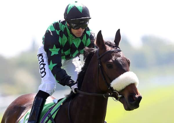 WINNING COMBINATION: Graham Lee and Clever Cookie, seen triumphing in the StanJames.com Stakes at York last year.