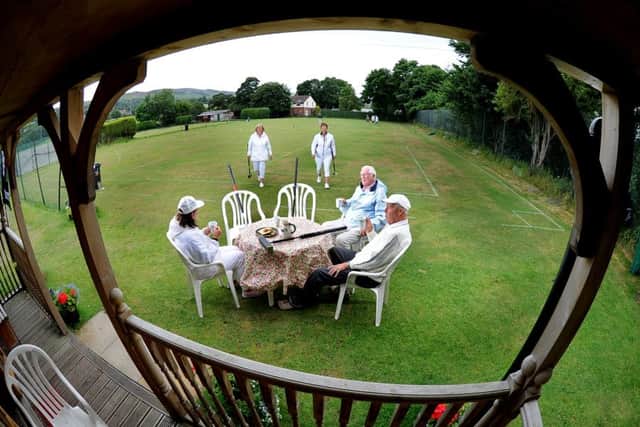 Taking a break from playing are, from left, Libby Dixon, Jane Bailey, Stephanie Ferguson, Will Drake, and Keith Terry at Ben Rhydding Sports Club, near Ilkley.
