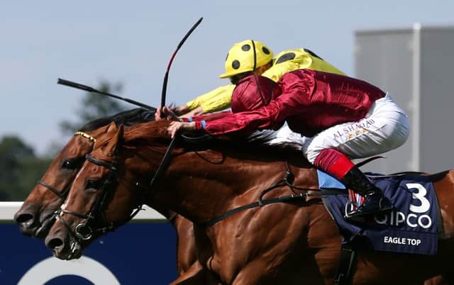 Postponed, ridden by Andrea Atzeni, beats Eagle Top, foreground, ridden by Frankie Dettori, in the King George VI And Queen Elizabeth Stakes (Picture: David Davies/PA Wire).