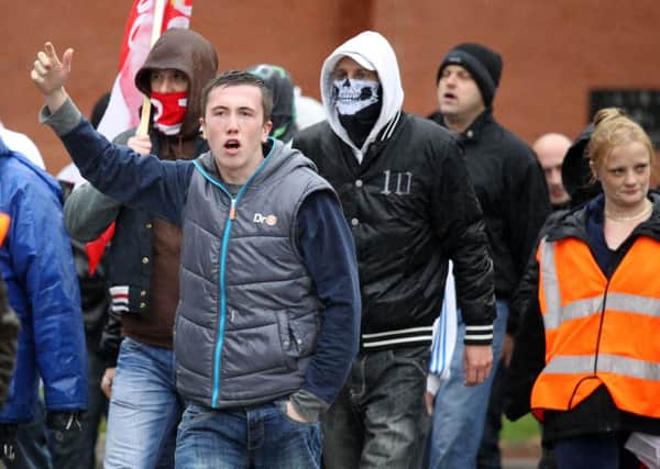 Members of the EDL marching through Rotherham last year.