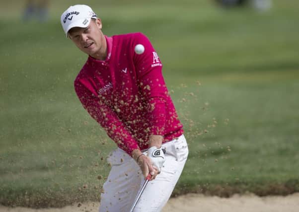 Danny Willett hits the ball out of a bunker during the final round of the Omega European Masters golf tournament in Crans-Montana, Switzerland on Sunday (Peter Klaunzer/Keystone via AP)