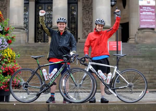 Matthew Calvert (left) and James Weaver  pictured after completing a Aberdeen to Leeds Bike Ride in aid the of the Anne Maguire fund, outside Leeds Town Hall. Picture by Simon Hulme