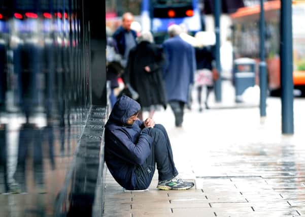 A beggars on Boar Lane in Leeds city centre. Picture: Jonathan Gawthorpe.