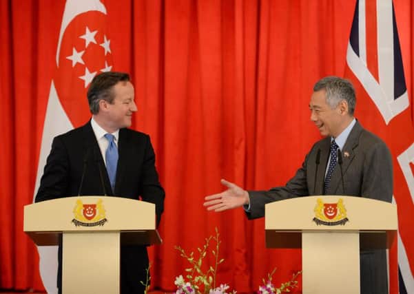 David Cameron holds a news conference with Singaporean Prime Minister Lee Hsien Loong at Istana, the Presidential Palace in Singapore.
