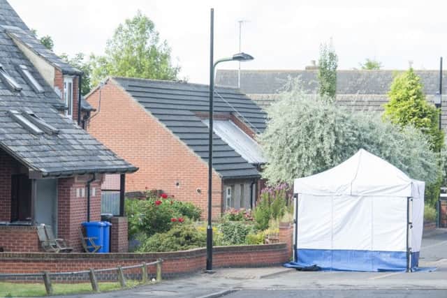 Police at the scene of the house fire at Bluebell Close in Sheffield which claimed the life of a male occupant