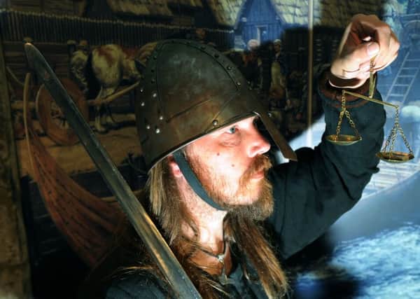 Viking warrior Mark Smith weighs part of the Vale of York Hoard, as part of the 'It's a Jorvik Life' at the Yorkshire Museum in York.


Picture : Jonathan Gawthorpe