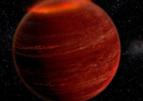 Undated handout photo issued by Caltech of an artist's impression of a powerful aurora surrounding "brown dwarf" LSR J1835+3259, after one has been discovered lighting up the skies of the distant brown dwarf, or "failed star".