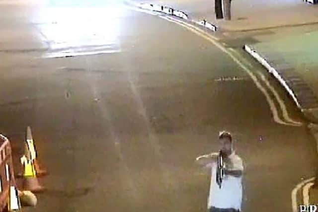 CCTV picture shows crazed alcoholic Stephen Barrett who has been jailed for holding a rifle to a womanâ¬"s head after downing 27 pints.