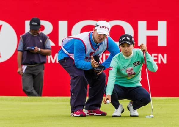 Hyo Joo Kim of Korea lines up a putt on the 18th green during the first round of the Ricoh Women's British Open 2015, at Trump Turnberry (Picture: Tristan Jones).