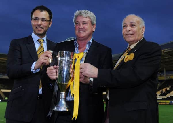 SWEET MEMORIES: Hull City manager Steve Bruce, centre, with owners Ehab Allam, left and Dr Assem Allam.